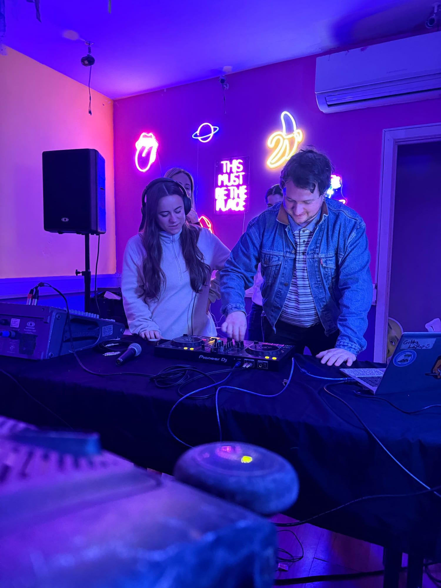 A group learning to DJ together