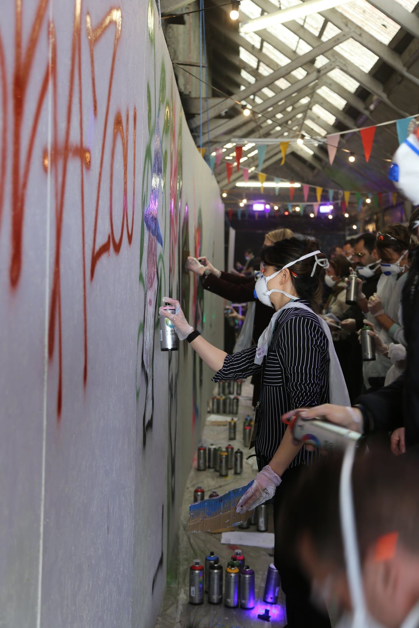 A group taking part in a graffiti workshop